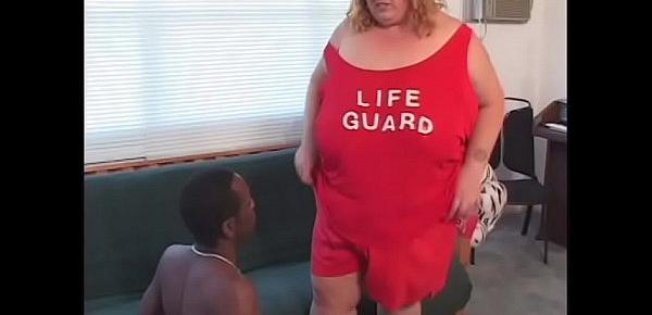  Fatty whore in lifeguard uniform is riding black rod